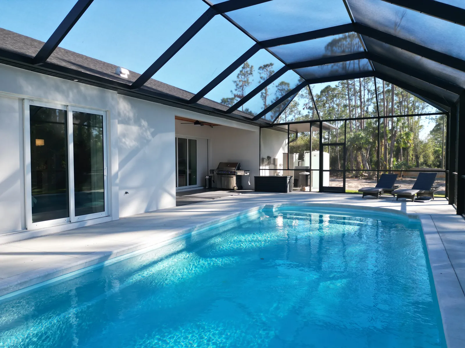 Custom home with screened pool enclosure