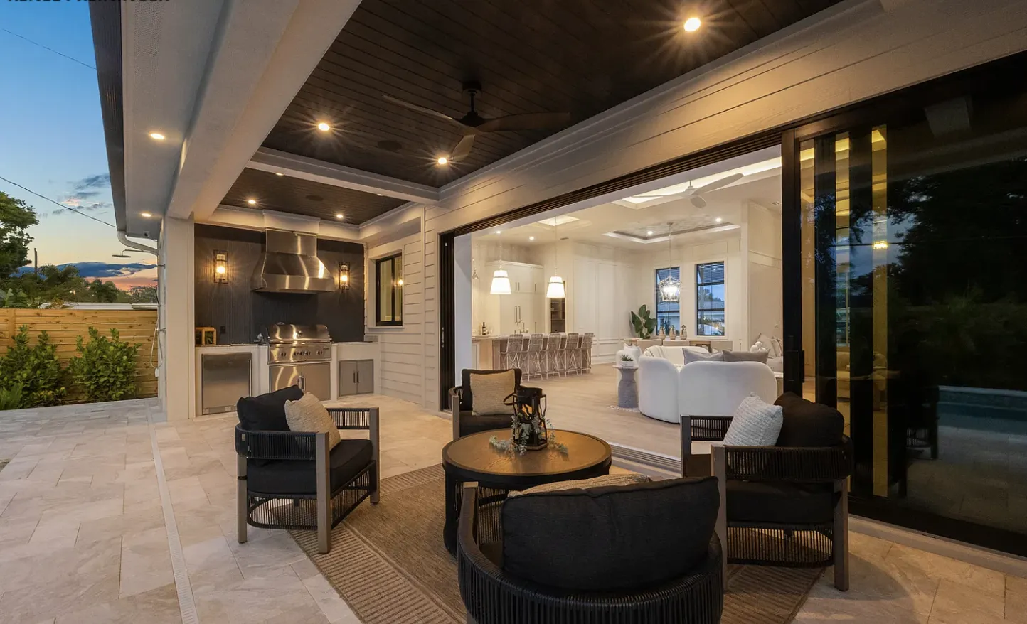 Living room with wood-detail ceiling in a custom home